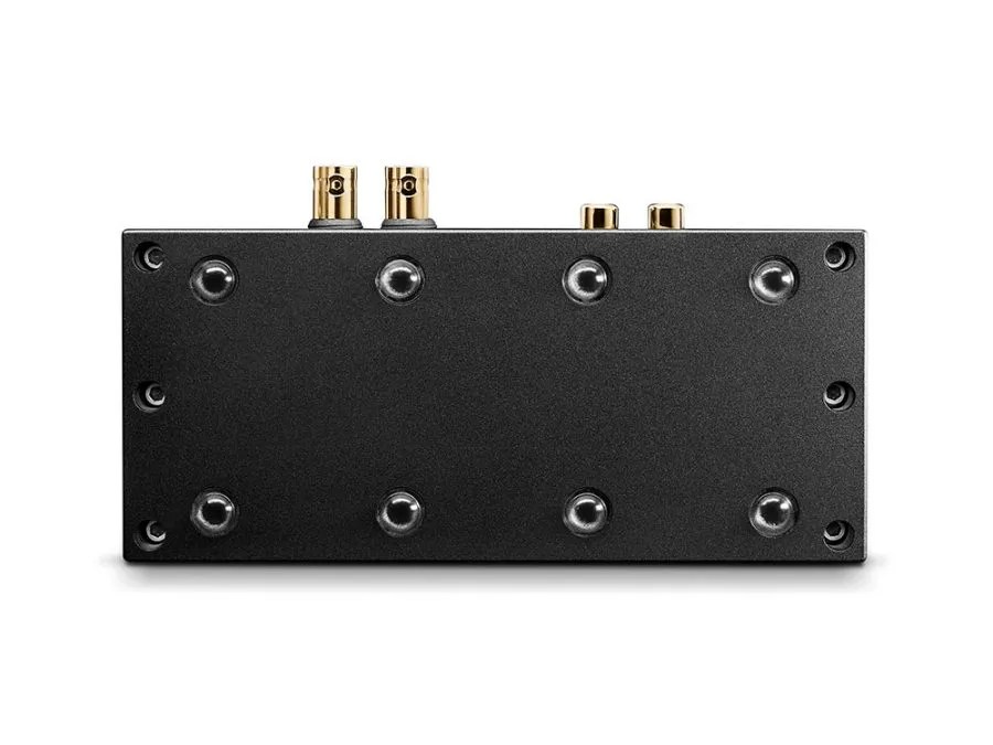 The underside of the Qutest, machined from solid aluminium, with its eight isolating feet and the connectors standing proud at the rear
