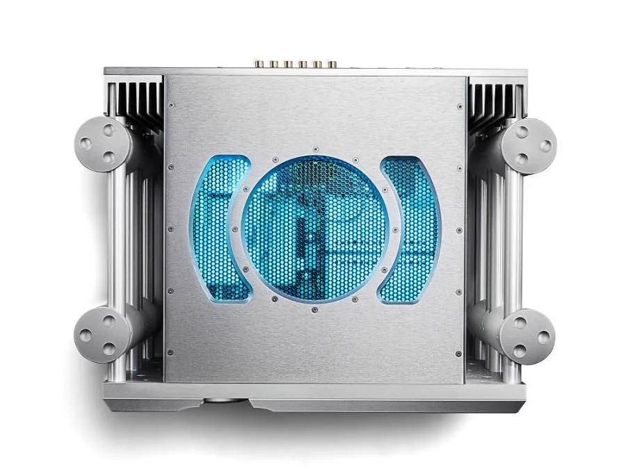 The silver ULTIMA PRE from above: the blue-lit circle and arc vent pattern over the electronics, framed by the four Integra legs