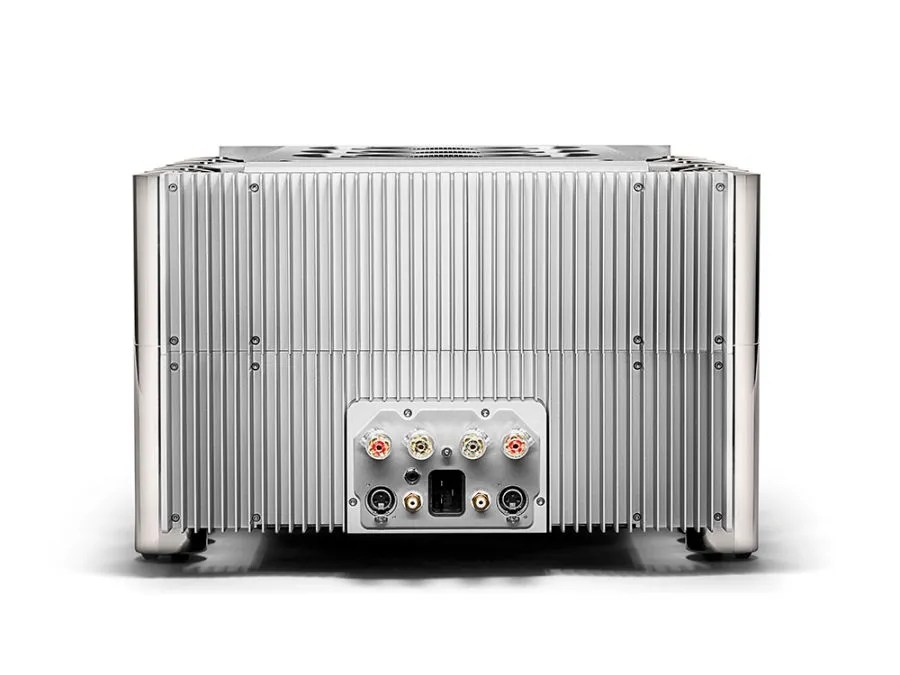 Rear of the ULTIMA: the full-width finned casework around the terminal plate with four binding posts, balanced and unbalanced inputs and the mains inlet