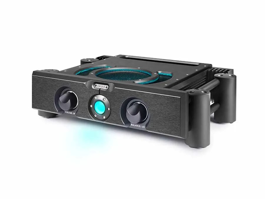 The black ULTIMA PRE 3 in three-quarter view: the VOLUME/IP and BALANCE/AV knobs either side of the central cyan power sphere, the CHORD badge and the Integra legs, with the lit vent on the top panel