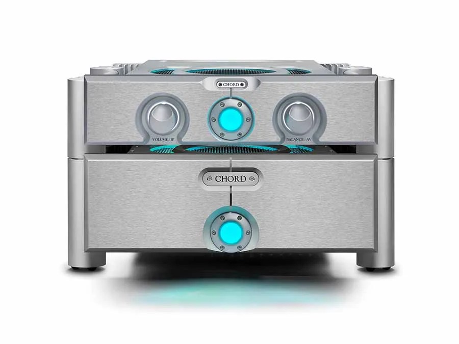 The silver ULTIMA PRE 3 stacked on a matching ULTIMA power amplifier, both fascias lit by their cyan power spheres