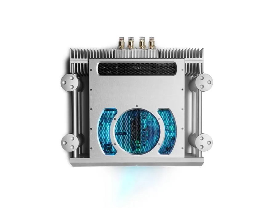 The silver ULTIMA 3 from above: the blue-lit circle and arc vent pattern, the four ball-topped Integra legs and the four gold binding posts along the rear edge